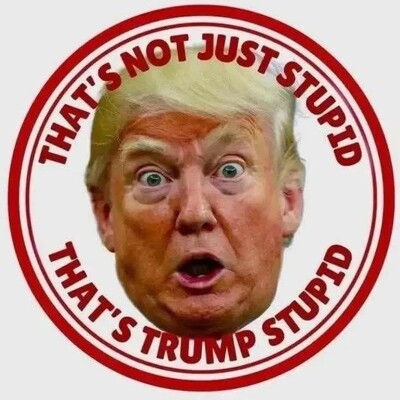 The image is a meme featuring a circular graphic with a prominent, exaggerated depiction of former U.S. President Donald Trump's face in the center. The background of the circle is white with a red border. Surrounding the face are two phrases written in bold, red capital letters: "THAT'S NOT JUST STUPID" at the top and "THAT'S TRUMP STUPID" at the bottom. The meme appears to be used as a reaction to highlight perceived stupidity or absurdity, attributing it to Trump.