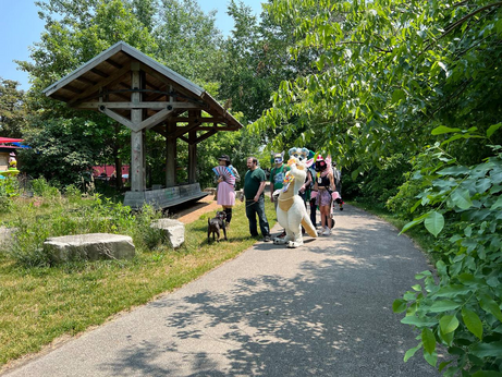 A photo from the Beerline Trail, with a group of furries checking things out