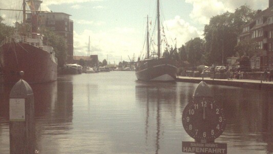 Photo of a harbor area with sail boats.