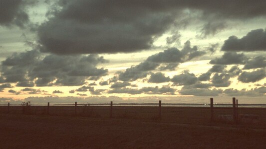 Photo of a field and sky at dusk