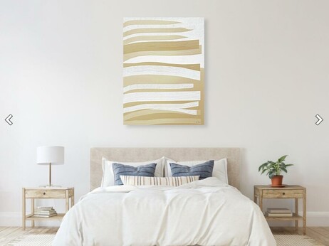 Clean white brush strokes on tan abstract painting in a bedroom furniture setting.  Art by Sharon Cummings.